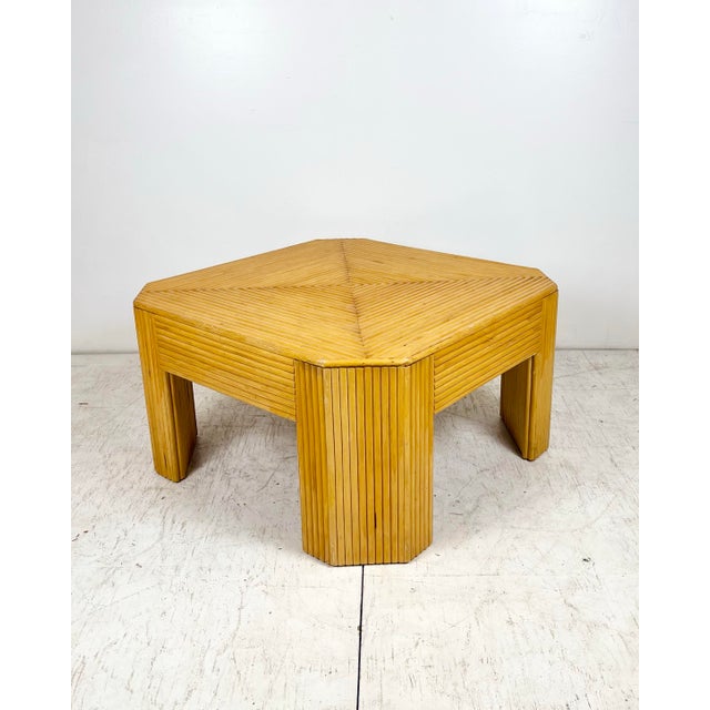 Vintage square split reed rattan coffee table with faceted corners. Radiating split reeds form triangular pattern on top,...