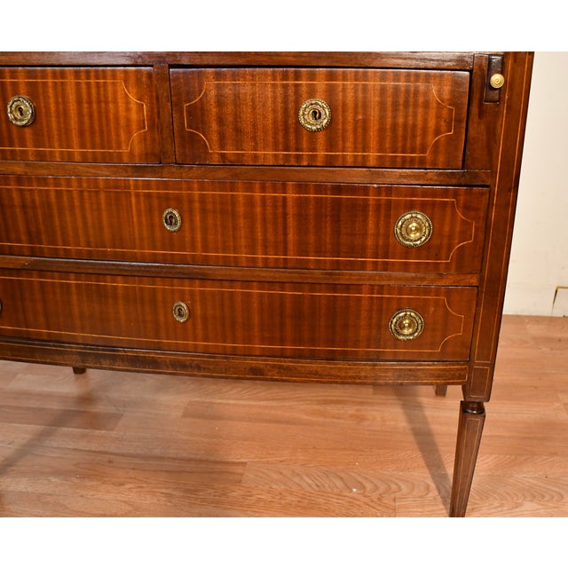 We are pleased to offer this beautiful Antique English Hepplewhite Mahogany Secretary Desk, from the 1920s. This desk is...