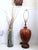 This striking mid-century drip glaze ceramic table lamp features a rich blend of amber, chestnut, and golden brown hues...