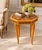 A charming vintage Italian octagonal side table featuring exceptionally detailed marquetry and inlaid decoration...