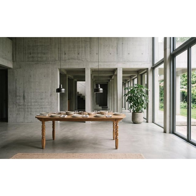 Oval Brutalist dining table designed by Henning Kjærnulf and produced in Denmark during the 1960s. Crafted in oak, the...