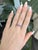 Five pink sapphires run across this solid 14K white gold band, set with four earth-mined diamond accents. Sapphire's...