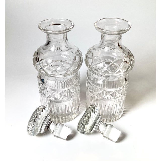 A Pair of European Cut glass spirit decanters with original stoppers. The round bottles with mushroom uppers with diamond...