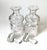 A Pair of European Cut glass spirit decanters with original stoppers. The round bottles with mushroom uppers with diamond...