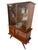 An elegant display cabinet from the mid-20th century (1950s), most likely of Italian origin. This piece features a refined...