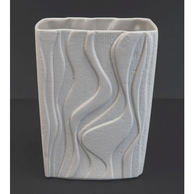 Porcelain vase dating from the late 1960s to early 1970s. White porcelain with a fine bark-like texture and relief...