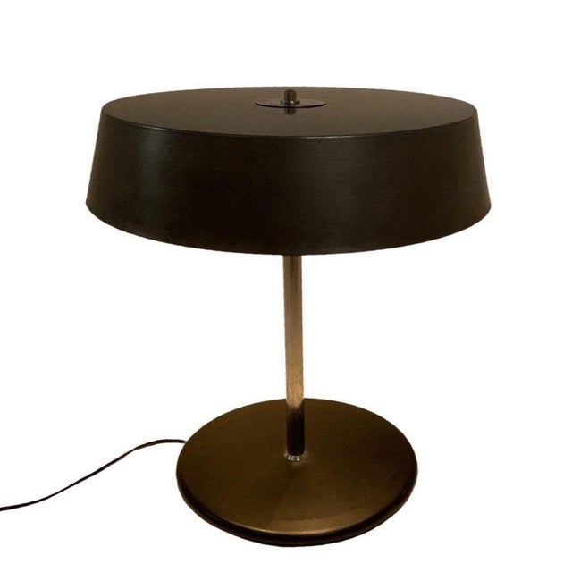 Vintage table lamp. Made from metal and made to withstand the test of time. Minor usermarks consistent with it’s age. can...