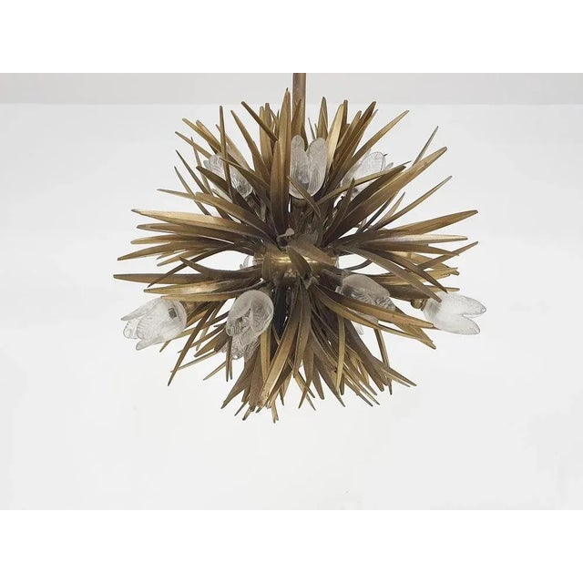 Brass florentine chandelier with glass flower details. We also have a matching floor lamp, but this one is missing some...