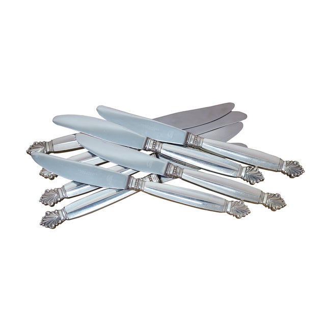 Eight antique Georg Jensen Denmark Sterling Silver 925 steel blade dinner knives in the Acanthus (Dronning) pattern. The...