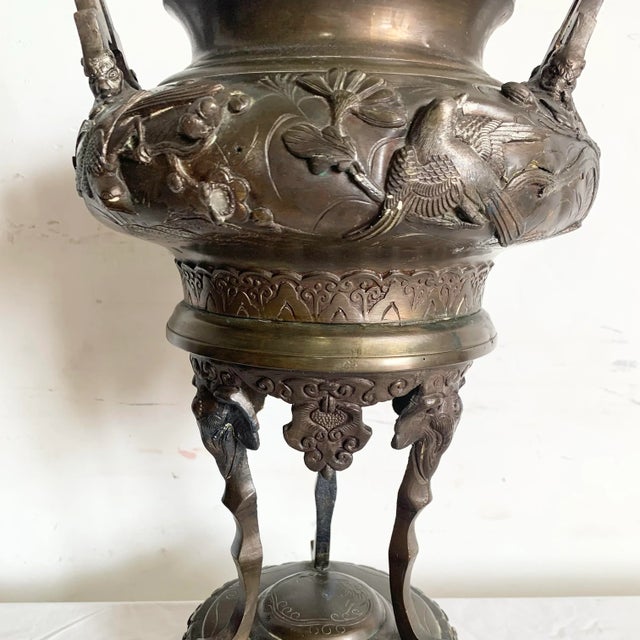 This stunning antique Chinese bronze censer features intricate craftsmanship, with detailed motifs of birds and florals in...