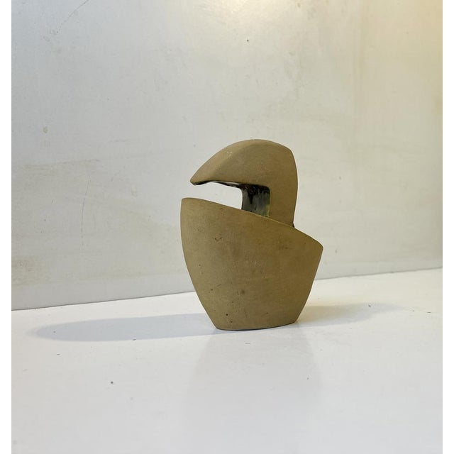 A 1960s sculptural surrealist ornament in partially glazed and hand-painted ceramic. An abstract form or being ovoid in...