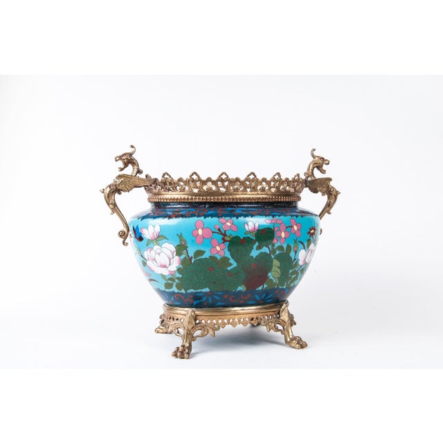 A French Japonisme ormolu-mounted Japanese cloisonné cachepot The cloisonne body having bird, flower and butterfly motif...