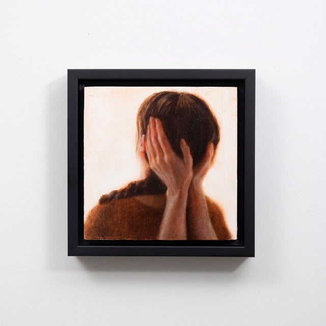 This intimate oil painting captures a figure with their hands pressed against their ears, conveying a profound sense of...