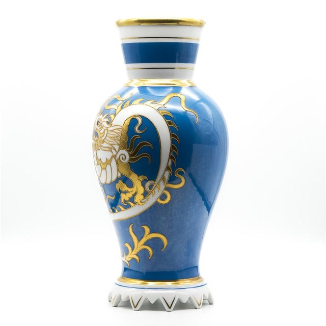 Tall Schaubach Kunst vase in turquoise glazed porcelain with hand-painted gilt dragon decor. The elongated body, tapered...