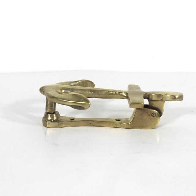 Vintage brass door knocker in the shape of an anchor. Has some nice patina. 5.75” long 3.75” wide 1.75” deep