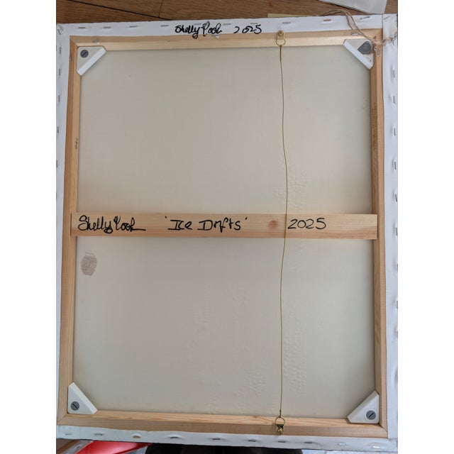 Ice Shifts captures the stillness and movement of frozen landscapes. Horizontal striations of muted whites, greys, and...