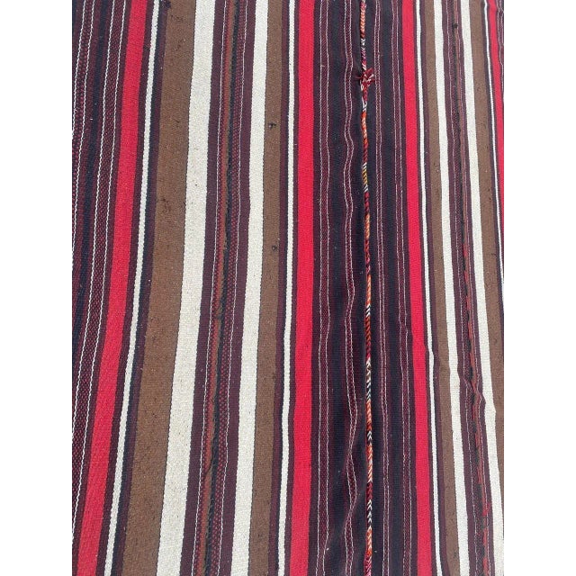 Nice vintage Kilim rug with a geometrical design and pretty colors, entirely hand woven with wool on wool foundation...