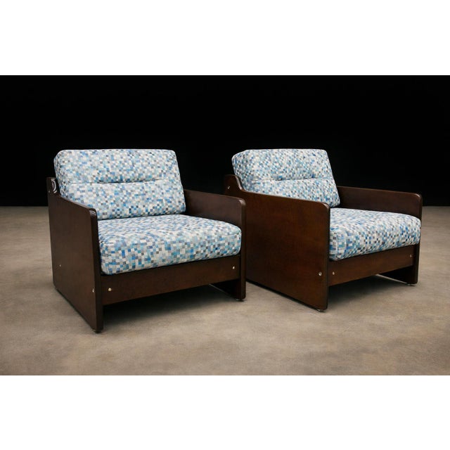 A refined and expressive pair of Brazilian modern armchairs designed by Geraldo de Barros, dating to the 1970s. Executed...