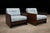 A refined and expressive pair of Brazilian modern armchairs designed by Geraldo de Barros, dating to the 1970s. Executed...