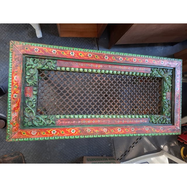 This is a vintage hand crafted Indian style low-profile coffee table featuring a hand-carved and hand-painted wooden...