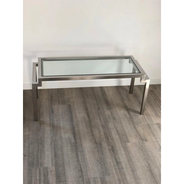 Design coffee table in chrome and glass made in Italy, circa 1970. In the style of Cy Mann.