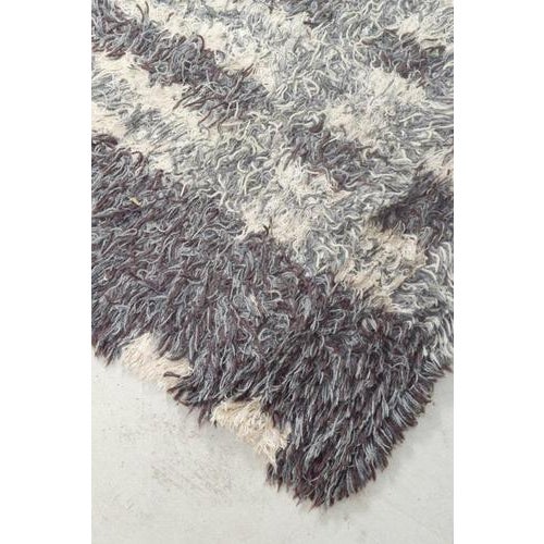 Scandinavian designer Rya carpet, 1960/70s. Hand-knotted rya Rug in wool with a geometric pattern in shades of grey and...