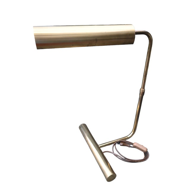 "Gold Metal Desk Lamp By Christian Liaigre" Desk lamp by Christian Liaigre in patinated gold metal with telescopic stem,...