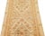 This contemporary hand-knotted wool runner from India is exquisitely designed with a beige field, adorned with a...