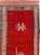 This mid-20th-century Turkish Anatolian runner presents a bold, sparsely ornamented composition centered on a rich red...