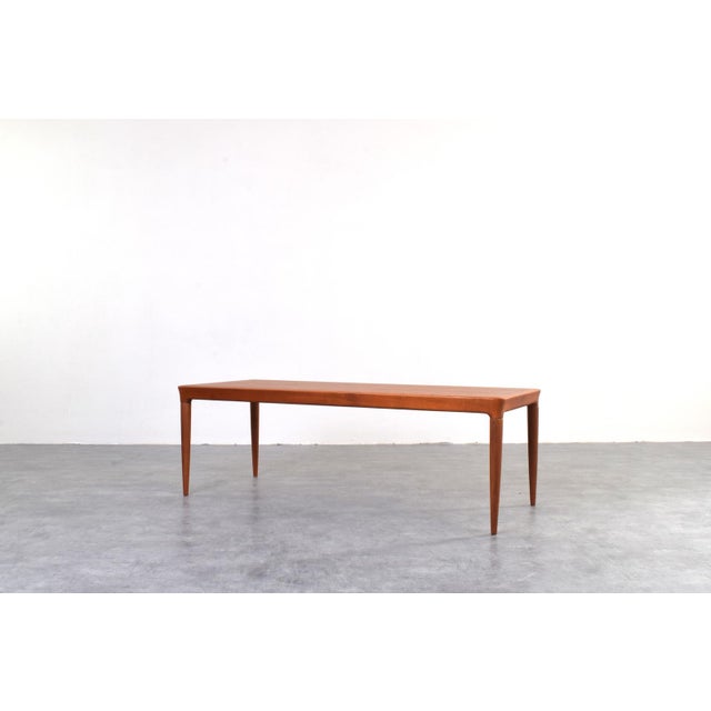 This teak coffee table was designed in the 1960s by Johannes Andersen for CFC Silkeborg. The furniture has been...