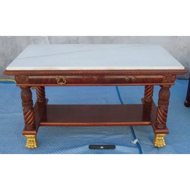 A superb Museum Piece-early 19th century (circa 1850), American center library table or Desk. Mahogany, finely carved with...