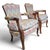 Pair of French Louis XV style bergère fauteuils featuring carved walnut frames with graceful cabriole legs, shaped aprons,...