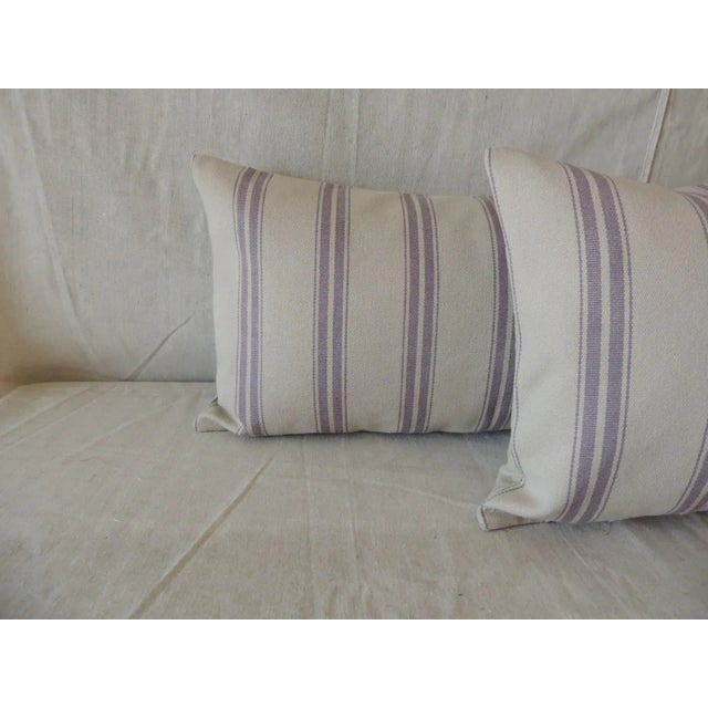 Pair of modern lavender and taupe long bolster decorative pillows. Taupe linen backings. Closure by stitch (no zipper...