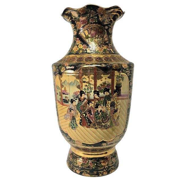 A striking 23.5-inch floor vase richly adorned in the Satsuma tradition, hand-painted with a luminous court scene of...