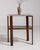 A compact Art Deco side table featuring a marble top and clean geometric lines. The contrast between materials creates a...