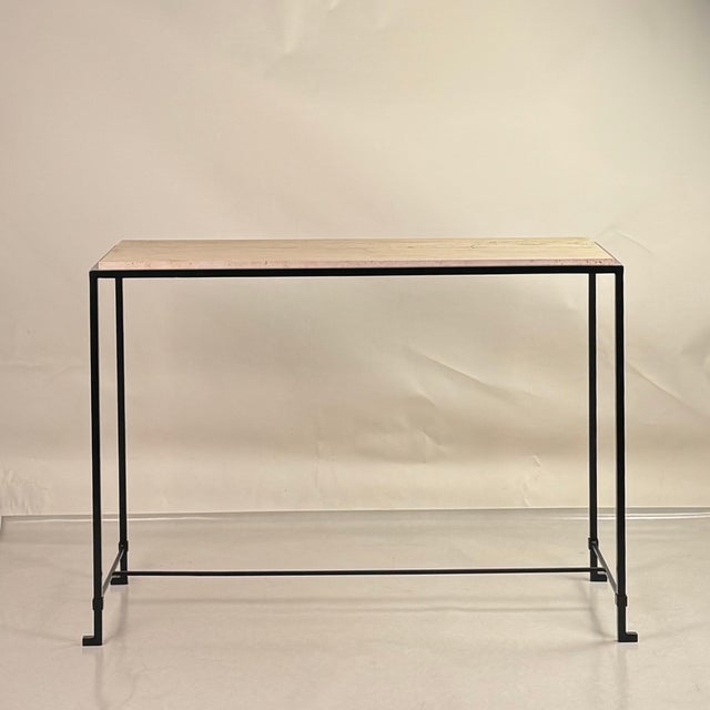 Large 'Diagramme' travertine console By DESIGN FRÈRES. Honed travertine top over a powder coated steel frame. Chic and...