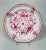 A striking set of six Meissen porcelain dessert plates in the coveted Indian Pink pattern, featuring intricate hand-...