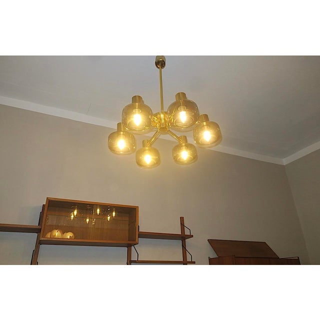 Impressive six-armed large chandelier in brass and blown smoked glass, in the style of or by Hans-Agne Jakobsson / AB...