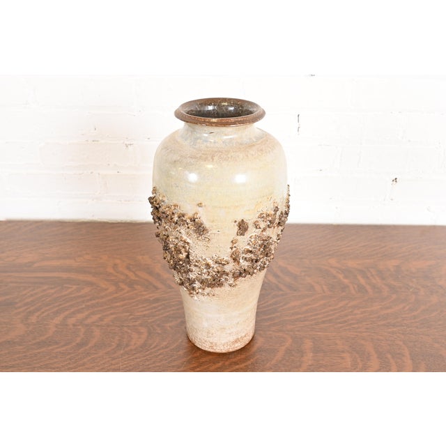 A gorgeous Mid-Century Modern "Lava" ceramic pottery vase By Glit Iceland Iceland, Circa 1960s Measures: 7"W x 7"D x...