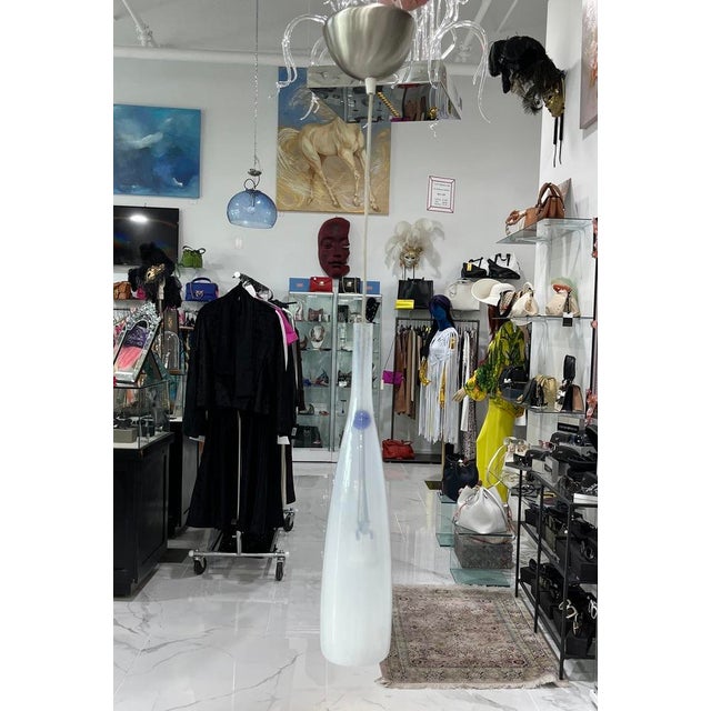 Price reduced $400. Now only $499! "Bottle" is a lovely suspension light made of Murano Glass by the furnaces of Mazzega....