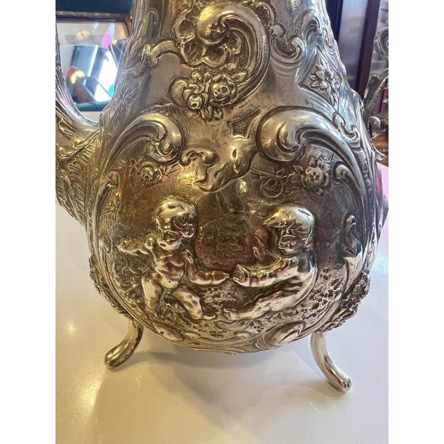 An exceptionally beautiful coffee pot in the Baroque/Historic style, handcrafted from 800 solid silver around 1910-1920....