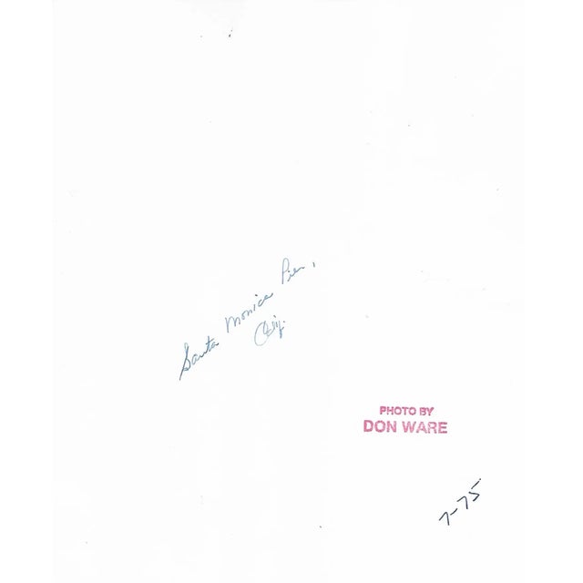 1975 black and white photo by Los Angeles, California Don Coleman Ware (1921-2006) of a boy fishing at Santa Monica Pier...