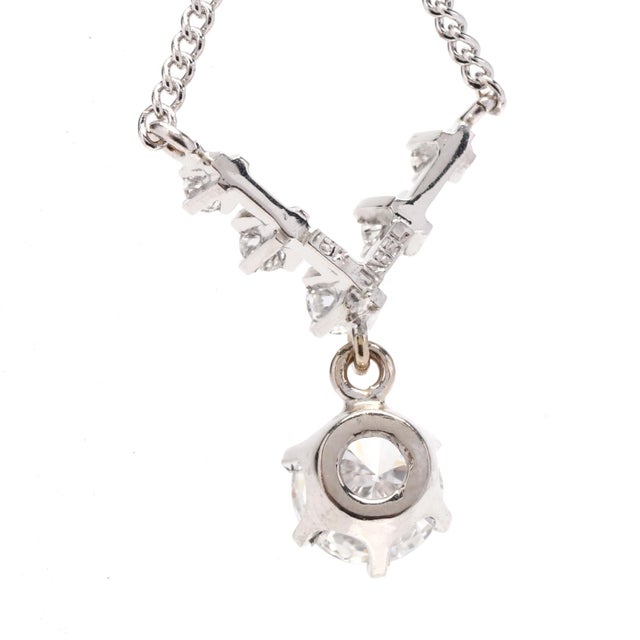 This 0.75ctw diamond dangle v necklace will make a beautiful statement. Crafted in 14K white gold, the necklace features...