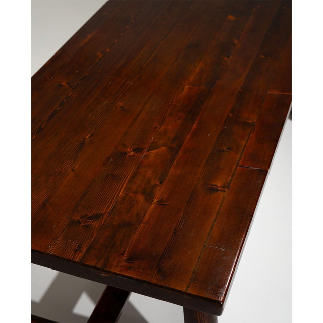 A refined French dining table by Georges Robert, crafted in solid pine during the 1950s. Defined by its sculptural...