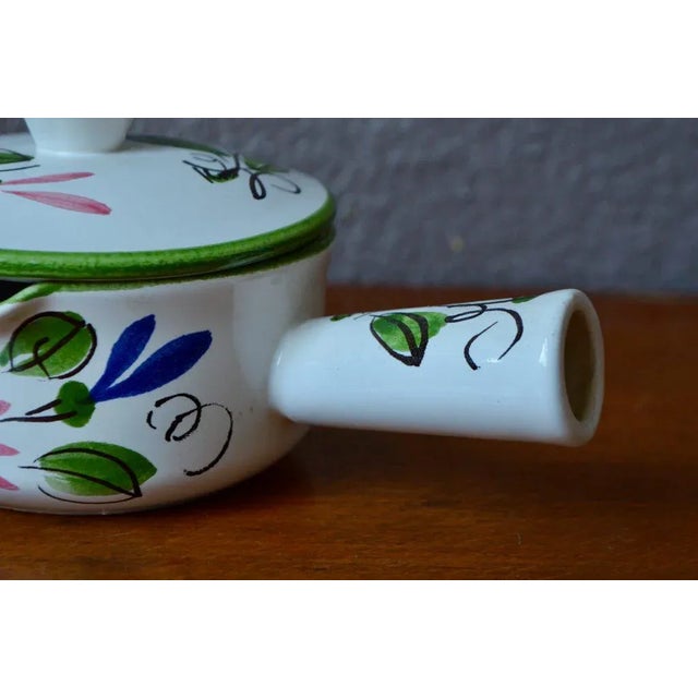 This charming little ceramic caquelon is a production of the Alsatian ceramics workshop Elchinger. Decorated with hand-...