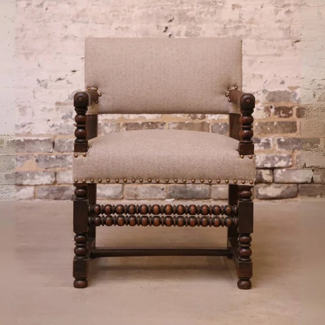 This 19th-century French bobbin chair showcases exquisite craftsmanship with its boldly turned spindle frame and hand-...