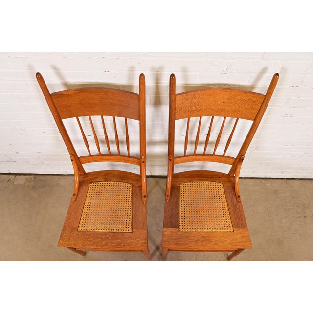 Early 20th Century Limbert Style Antique Arts & Crafts Carved Oak Cane Seat Spindle Back Side Chairs or Dining Chairs, Pair For Sale - Image 5 of 11