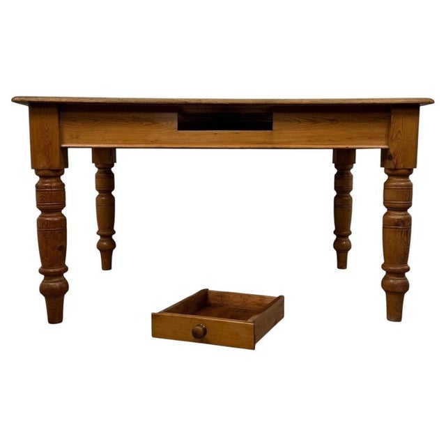 A charming and beautifully crafted 20th-century farmhouse dining table, constructed in solid pine and distinguished by its...