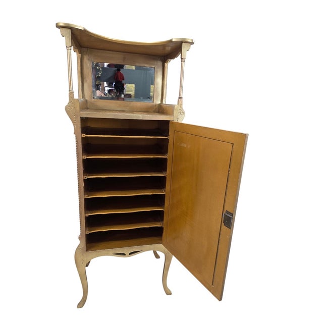 Antique Victorian Hand-Painted Music Cabinet with Brass Gallery and Beveled Mirror An elegant antique giltwood music...