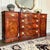 An Exceptional 1950s Henredon sideboard showcasing luminous crotch mahogany, a sculpted serpentine front, refined inlay,...
